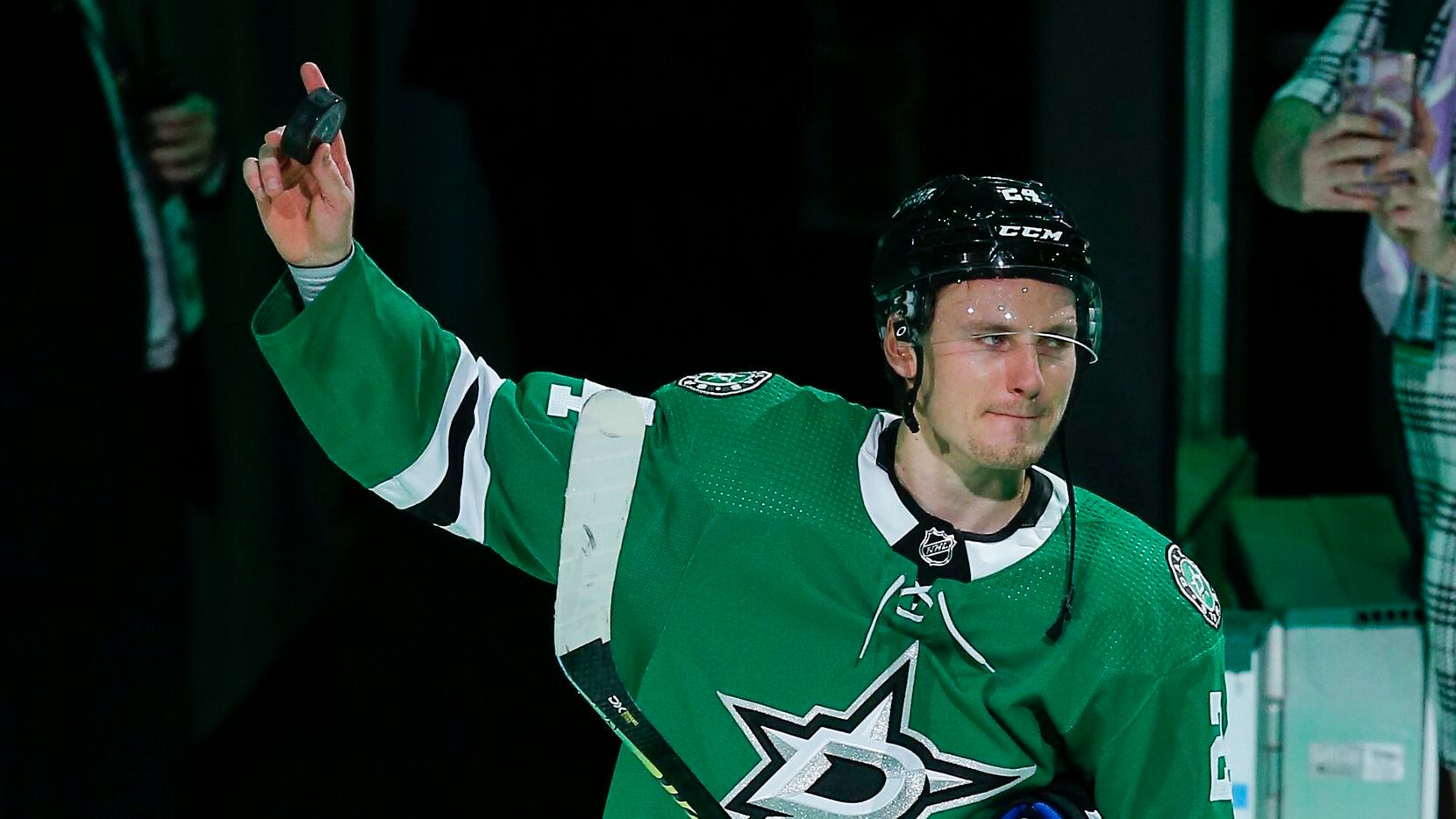 Dallas Stars forward Roope Hintz (24) acknowledges fans after being named the first star of...