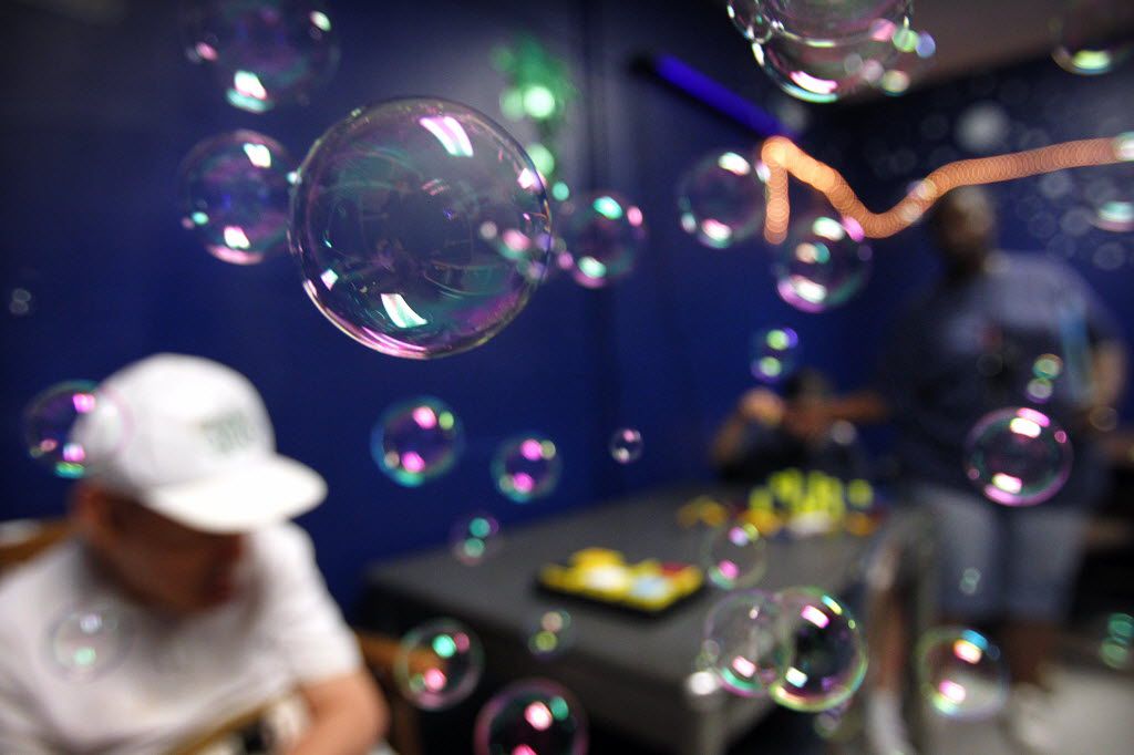 Intellectual and developmentally disabled residents receive sensory therapy through blowing bubbles at the Austin State Supported Living Center, Thursday, July 14, 2011, in Austin, Texas.   (Tom Fox/The Dallas Morning News)  Summary: Texas has spent tens of millions of dollars to improve conditions at the stateÃs 13 large, campus-style residential institutions for the mentally disabled. But halfway through a four-year settlement agreement with the U.S. Department of Justice, the Ã’state supported living centersÃ have complied with only 12 percent of the provisions, according to nine compliance reports just completed in a second round of semiannual visits by independent monitors.