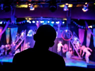 Director Derek Whitener watches his actors perform the first act of Pippin during a dress...