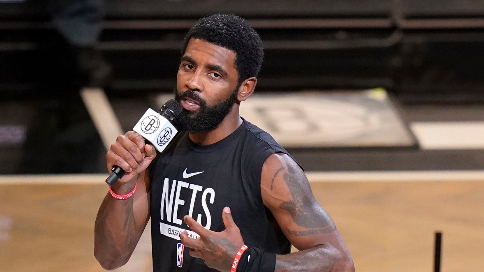 FILE - Brooklyn Nets' Kyrie Irving speaks before the team's NBA basketball game against the...