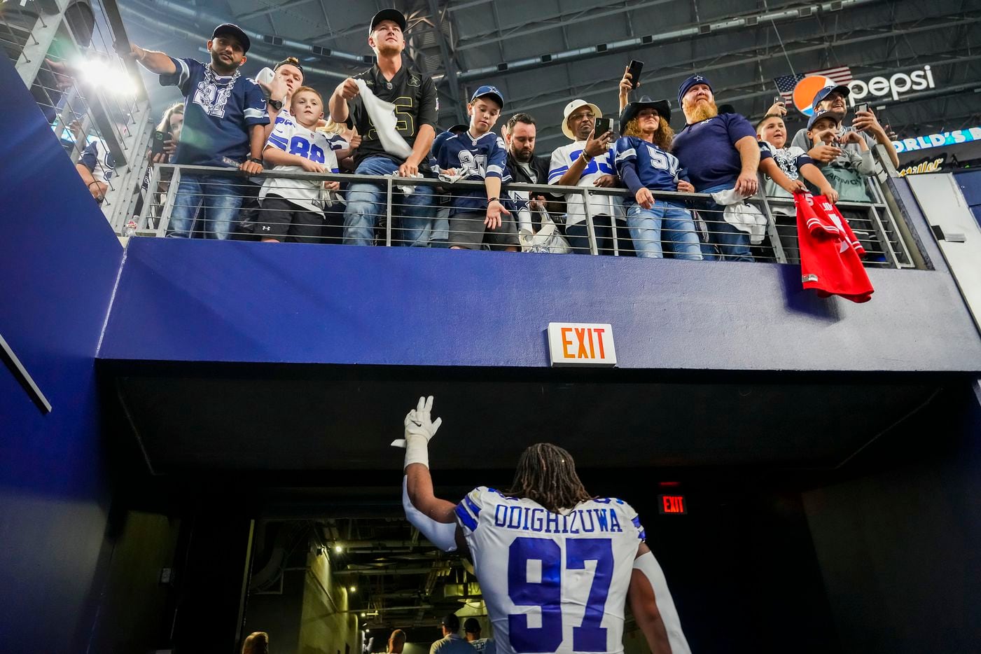 Dallas Cowboys defensive tackle Osa Odighizuwa waves to fans as he leaves the field following a victory over the Washington Football Team in an NFL football game at AT&T Stadium on Sunday, Dec. 26, 2021, in Arlington. The Cowboys won the game 56-14.