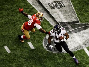 NEW ORLEANS, LA - FEBRUARY 03:  Bernard Pierce #30 of the Baltimore Ravens runs with the ball in the second half against Aldon Smith #99 of the San Francisco 49ers during Super Bowl XLVII at the Mercedes-Benz Superdome on February 3, 2013 in New Orleans, Louisiana.  (Photo by Rob Carr/Getty Images)