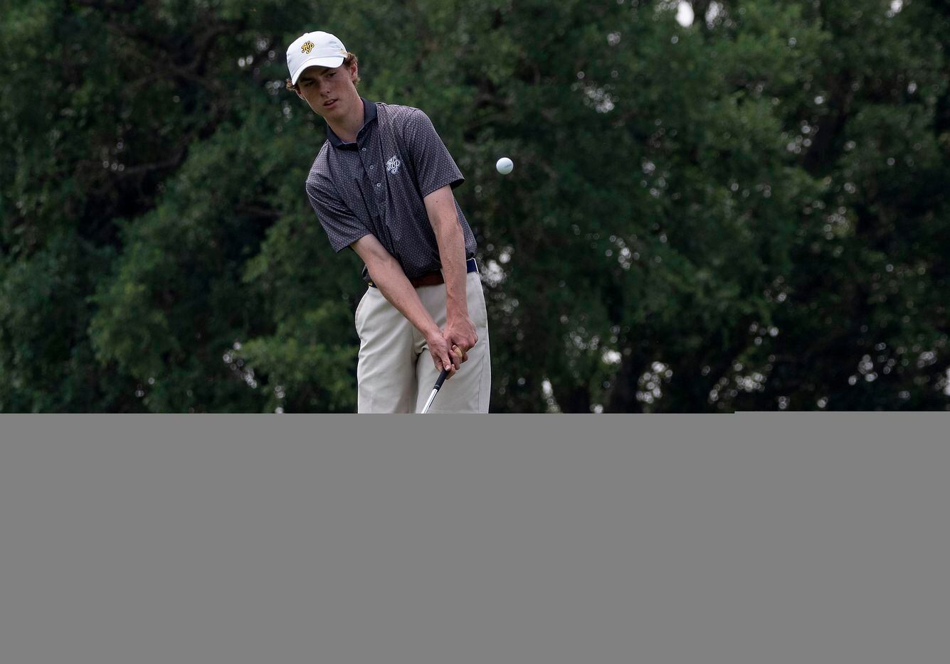 Highland Park, Will Blankenship, chips up on the no. 17 green during the first round of UIL...
