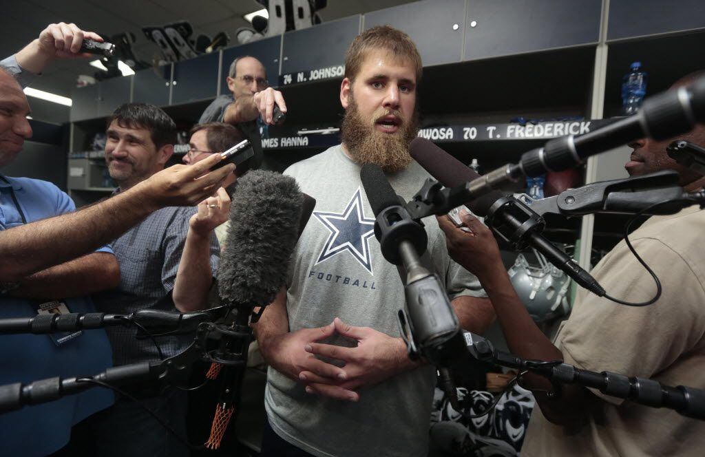 Center Travis Frederick (70) talks to the media during Dallas Cowboys rookie minicamp at...