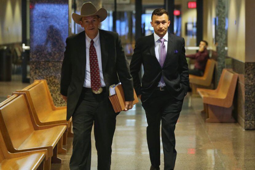 Johnny Manziel (right) walks in to the Frank Crowley Courts Building with his attorney Jim...