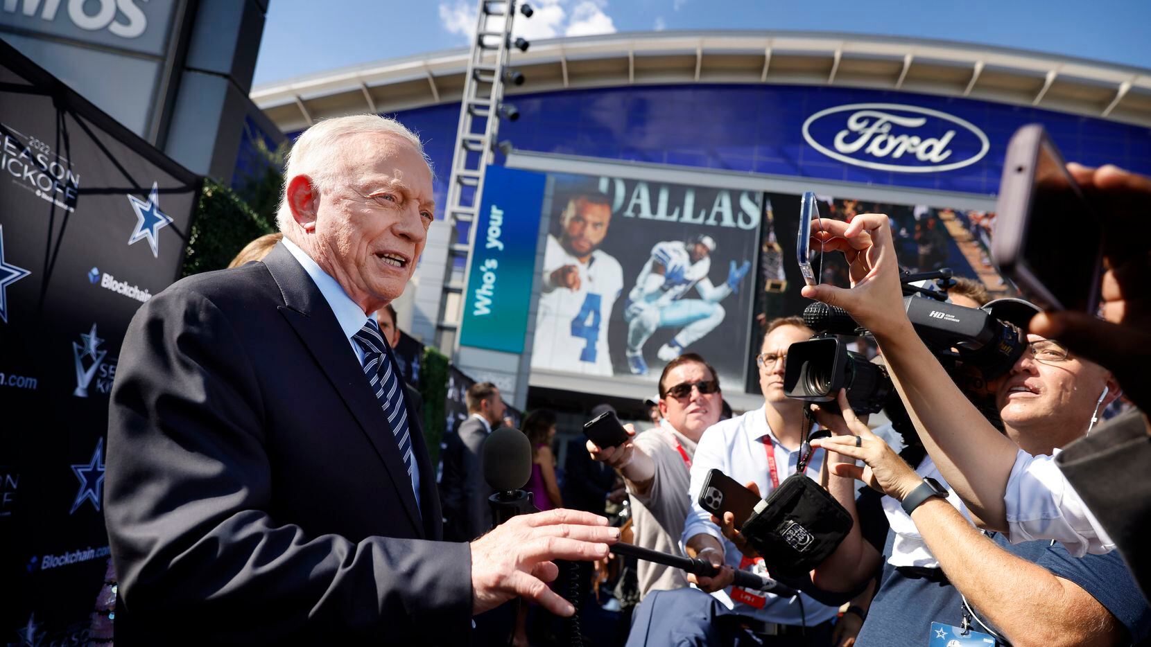 Dallas Cowboys owner Jerry Jones answers questions on the blue carpet as he arrives to the...