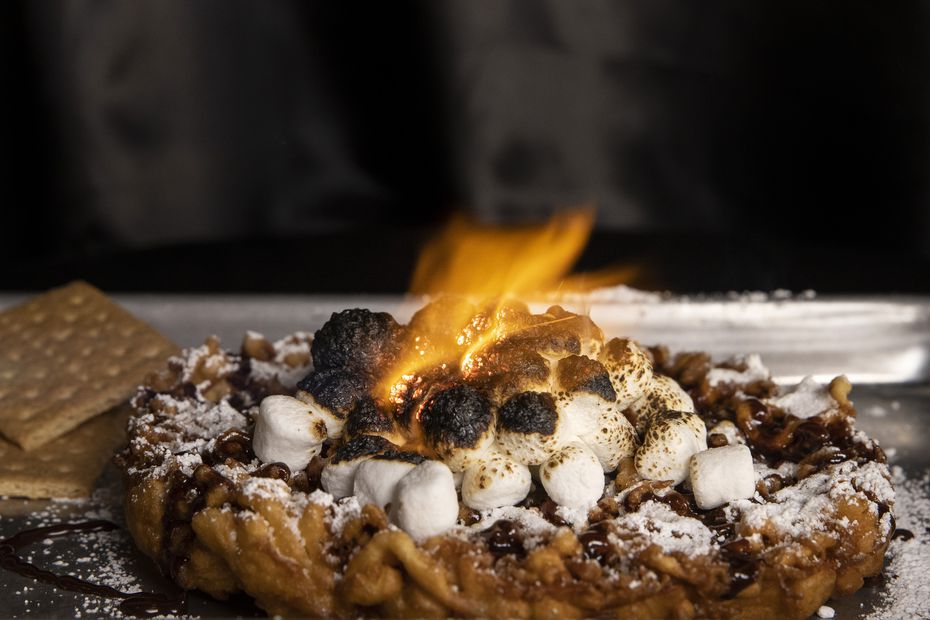 On a Wednesday afternoon in January, middle school and high school kids stopped into CornDog With No Name to order funnel cakes. The Bonfire comes topped with s'mores ingredients.