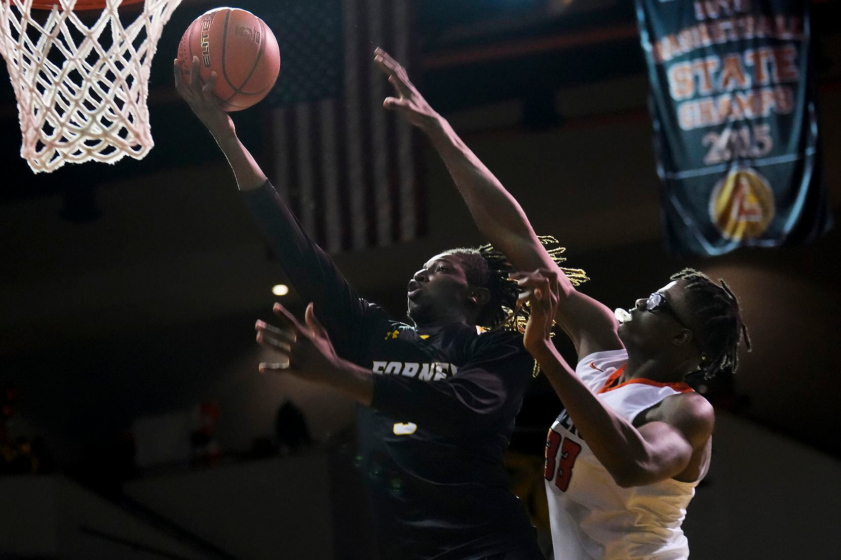 Forney guard Jaden Jefferson (3) drives to the basket as Lancaster's Amari Reed (33) defends...