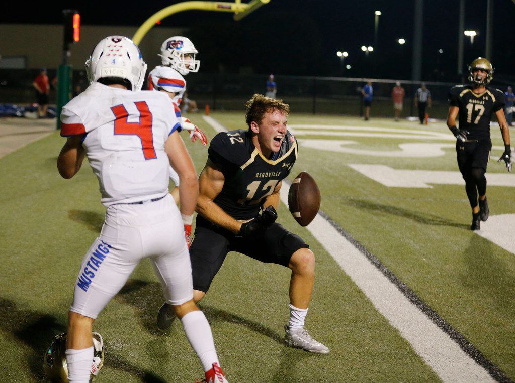 Birdville's Gage Haskin (12) celebrates his touchdown reception in front of Grapevine defender Jack Turner (4) during the first half of their high school football game in North Richland Hills, Texas on October 4, 2019. (Michael Ainsworth/Special Contributor)

