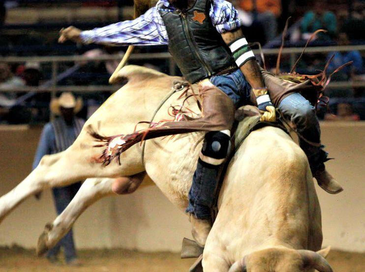 Bull rider Kendrick Mack competes at the 26th Annual Texas Black Invitational Rodeo. 