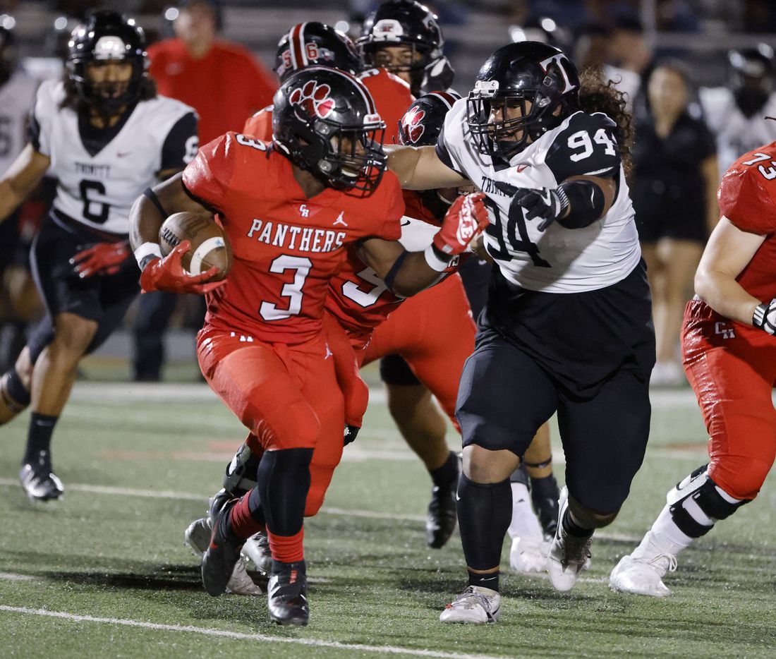 Euless Trinity defender Hiva Afungia (94_ chases Colleyville Heritage running back Isaac Shabay (3) during the first half of a high school football game in Grapevine, Texas on Friday, Sept. 10, 2021. (Michael Ainsworth/Special Contributor)