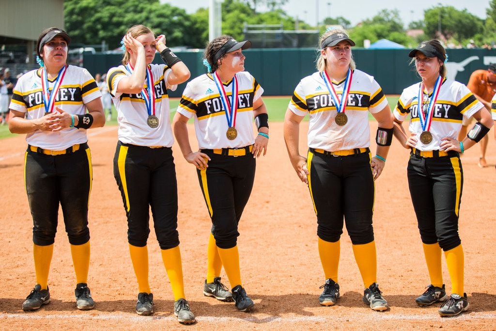 Forney softball players receive semifinals medals after a 7-6 loss in the 11th inning of a UIL Class 5A state semifinal softball game between Forney and Angleton on Friday, May 31, 2019 at Red & Charline McCombs Field at the University of Texas in Austin. (Ashley Landis/The Dallas Morning News)
