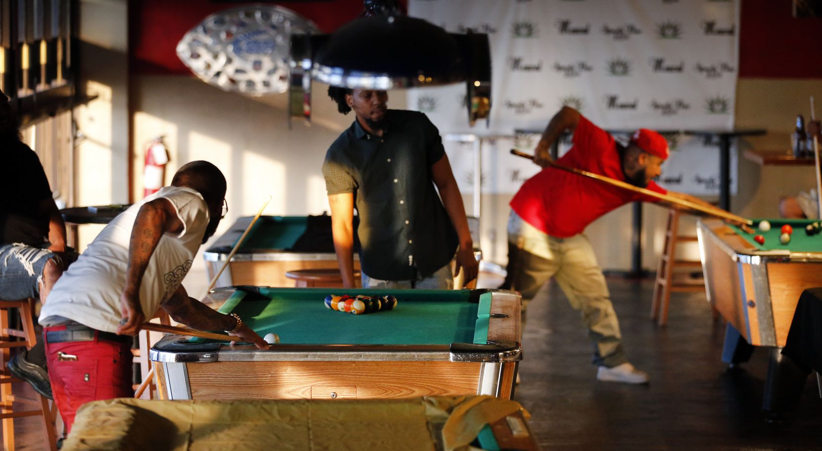 Every other pool table at Mezcal Sports Bar and Grill was covered to help create social...