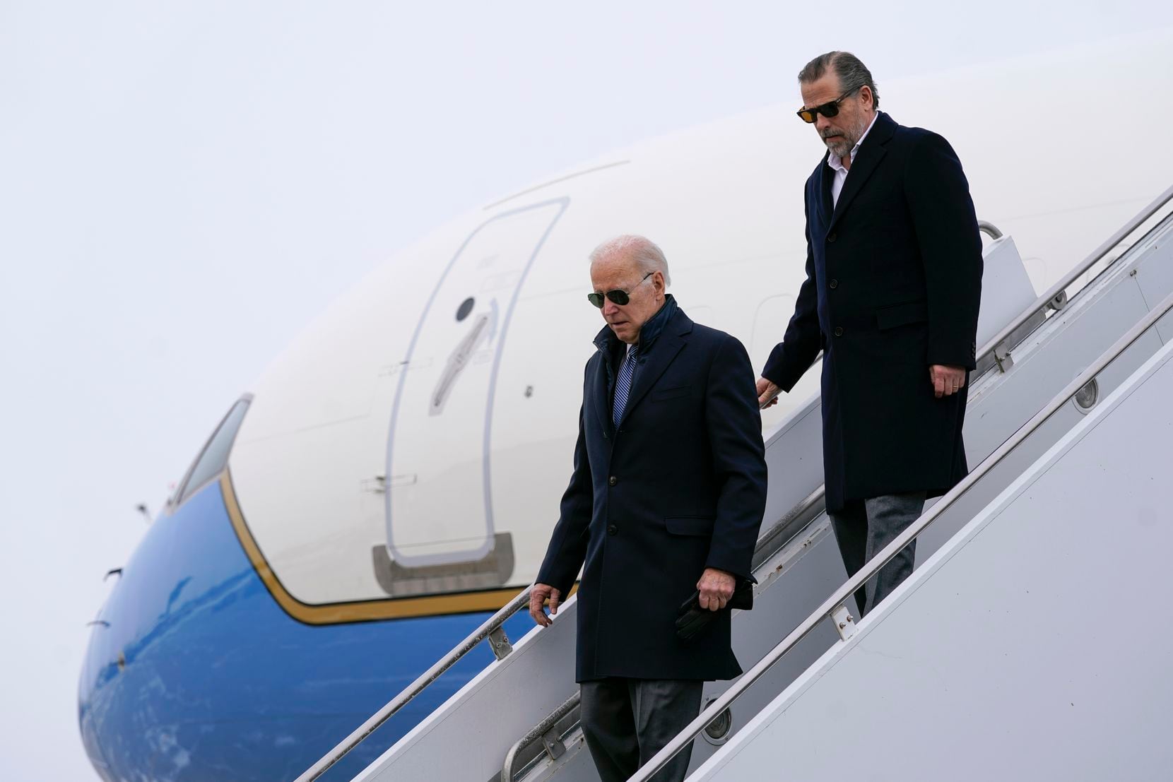 President Joe Biden and his son, Hunter Biden, step off Air Force One, Saturday, Feb. 4,...