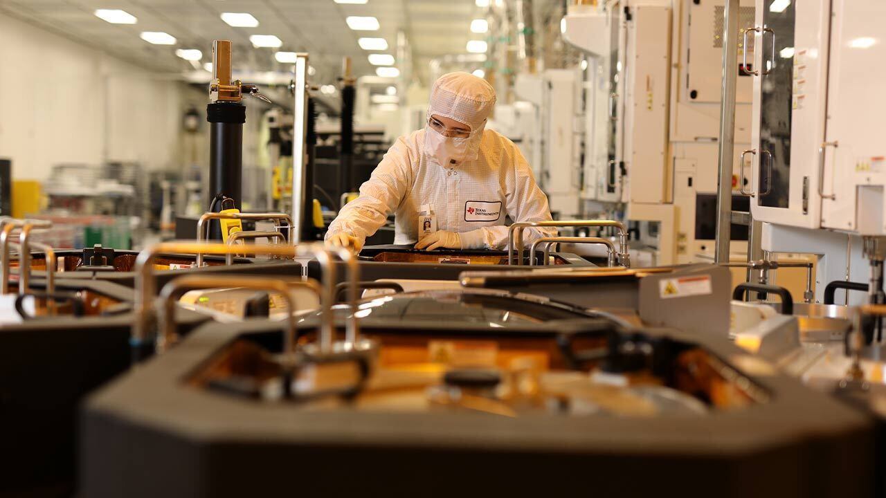 A Texas Instruments worker inside the company's new 300-millimeter analog wafer plant. 