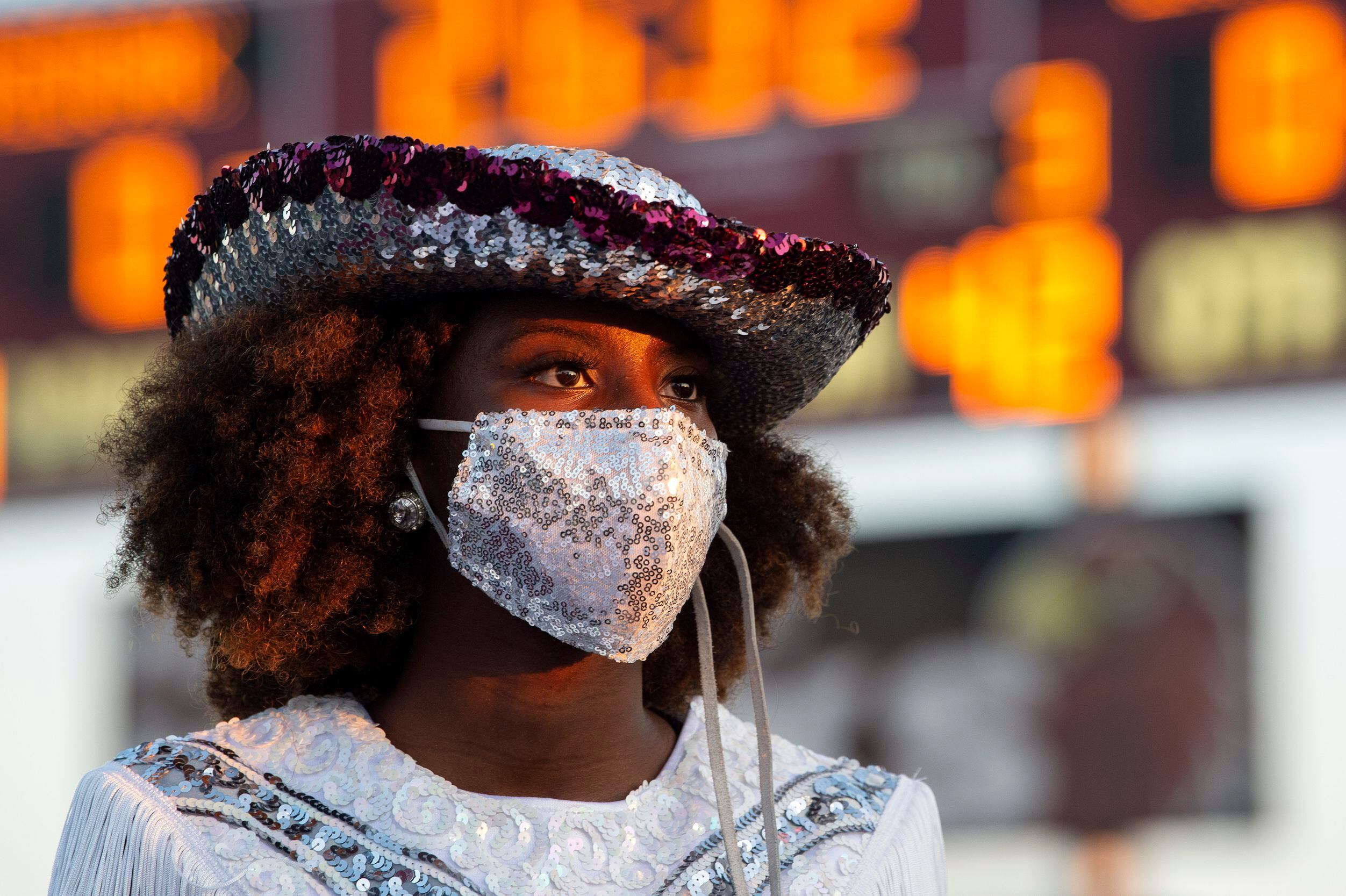 Red Oak junior Hawkette Sania Robinson wears a sequined mask before a high school football...