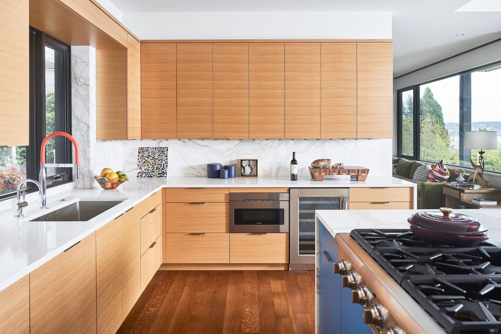 A kitchen features warm wood details on the cabinets.