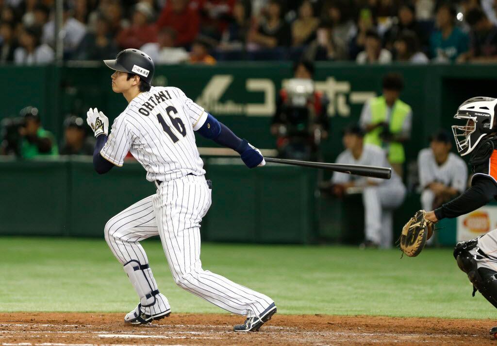 FILE - In this Nov. 12, 2016, file photo, Japan's designated hitter Shohei Ohtani watches the flight of his solo home run off Netherlands' pitcher Jair Jurrjens in the fifth inning of their international exhibition series baseball game at Tokyo Dome in Tokyo. 