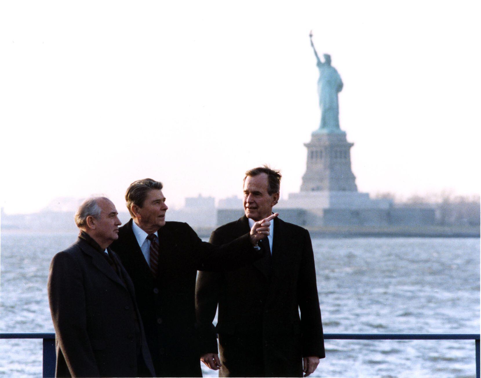 ORG XMIT: *S0409130289* Then-President Ronald Reagan is flanked by  Sovier President Mikhail...