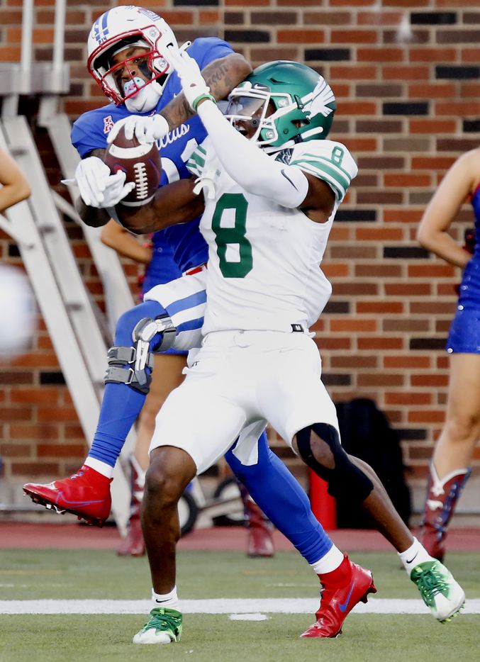 North Texas Mean Green defensive back John Davis Jr. (8) was credited with an interception with a pass intended for Southern Methodist Mustangs wide receiver Reggie Roberson Jr. (21) during the first half as SMU hosted UNT at Ford Stadium in Dallas on Saturday, September 11, 2021. (Stewart F. House/Special Contributor)