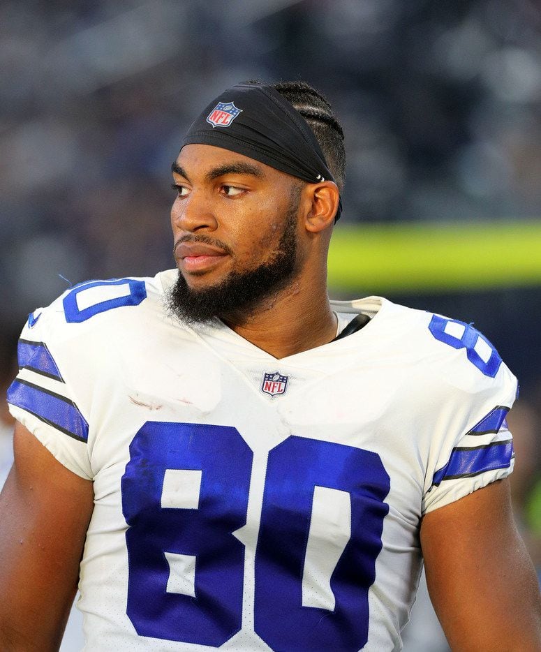 ARLINGTON, TX - AUGUST 26:  Rico Gathers #80 of the Dallas Cowboys stands on the sidelines...