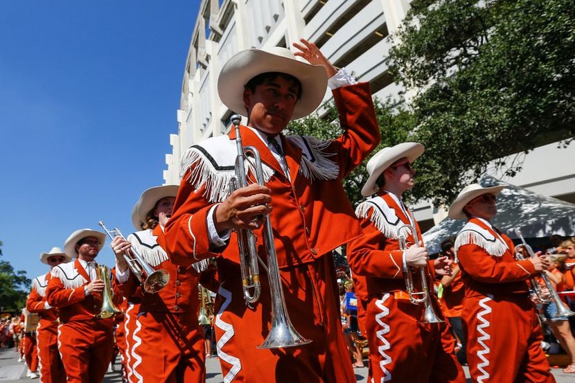 The Longhorn Band marches during the Bevo Parade prior to a college football game between...
