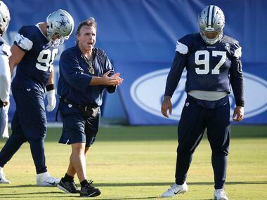 Dallas Cowboys defensive line coach Jim Tomsula works with the defensive line during the...
