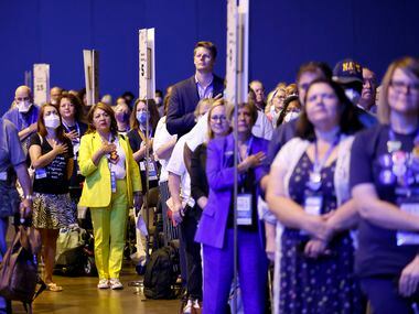 Delegates and guests stand for the national anthem as the 2022 Texas Democratic Convention...