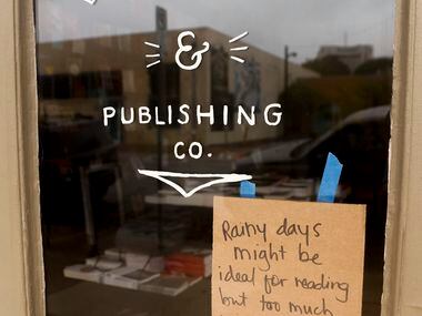 A sign informs customers that Deep Vellum is closed due to flooding in Deep Ellum, Tuesday,...