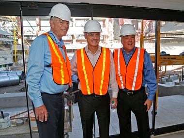 MLB commissioner Rob Manfred (center) stands with Texas Rangers owners Ray Davis (left) and Neil Leibman while Manfred visited Globe Life Field in Arlington to view the construction on Tuesday, November 19, 2019.
