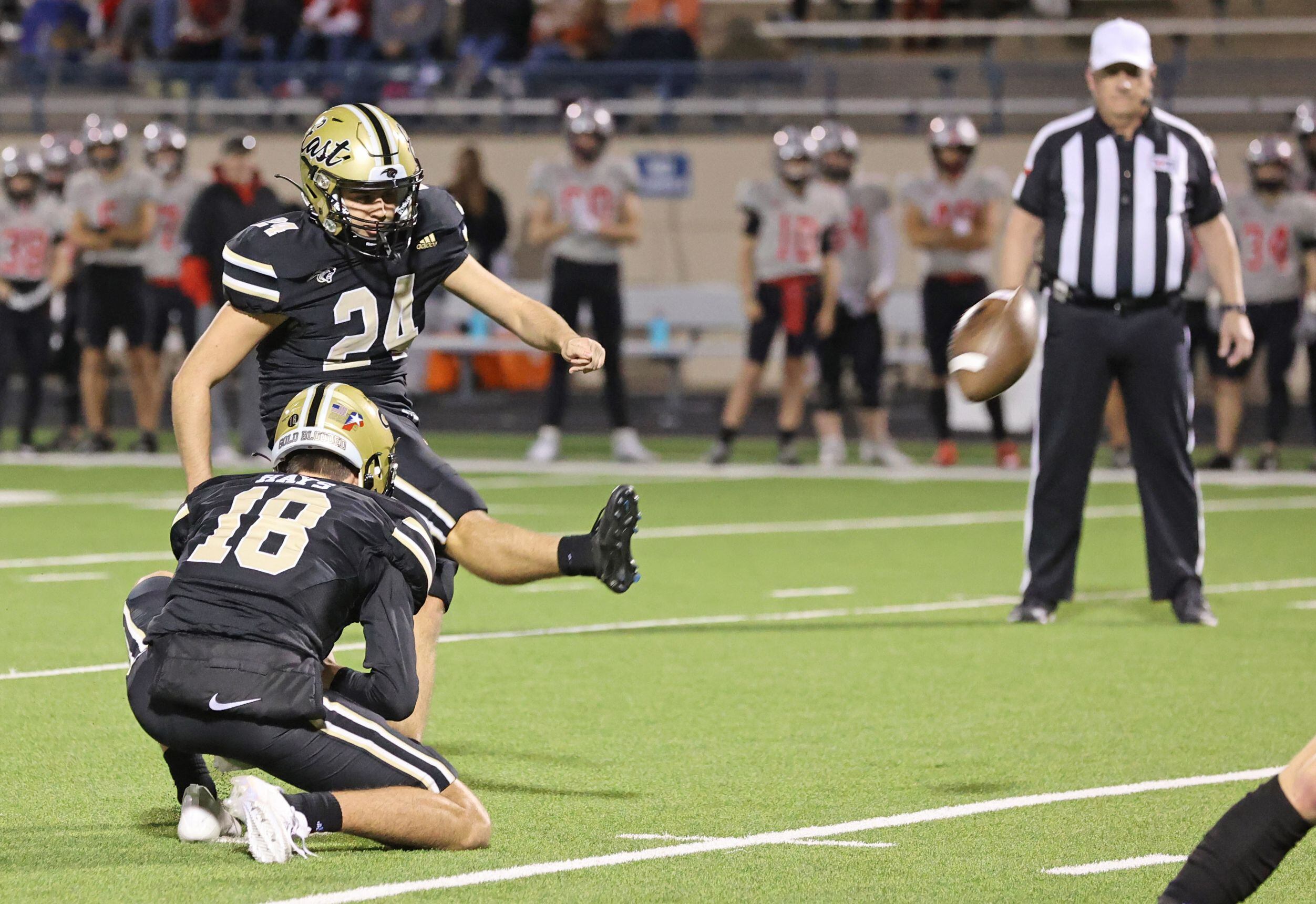 Plano East high kicker Justin Simmons (24) kicks a field goal during the first half of a...
