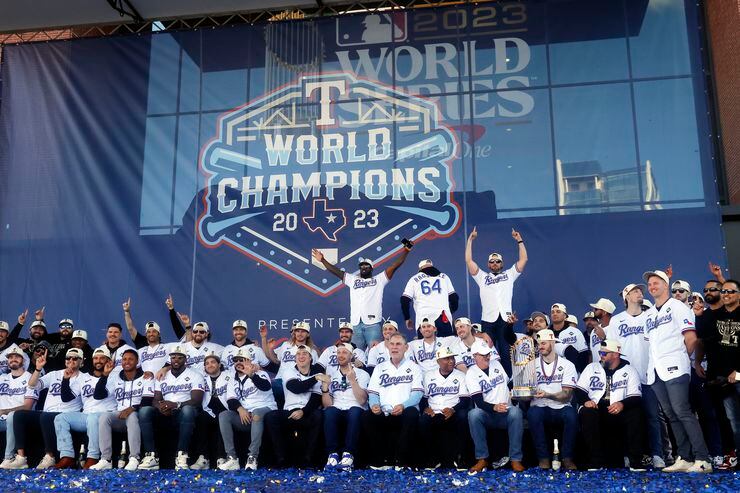 The Texas Rangers baseball team poses for a photo following the World Series Victory Parade...