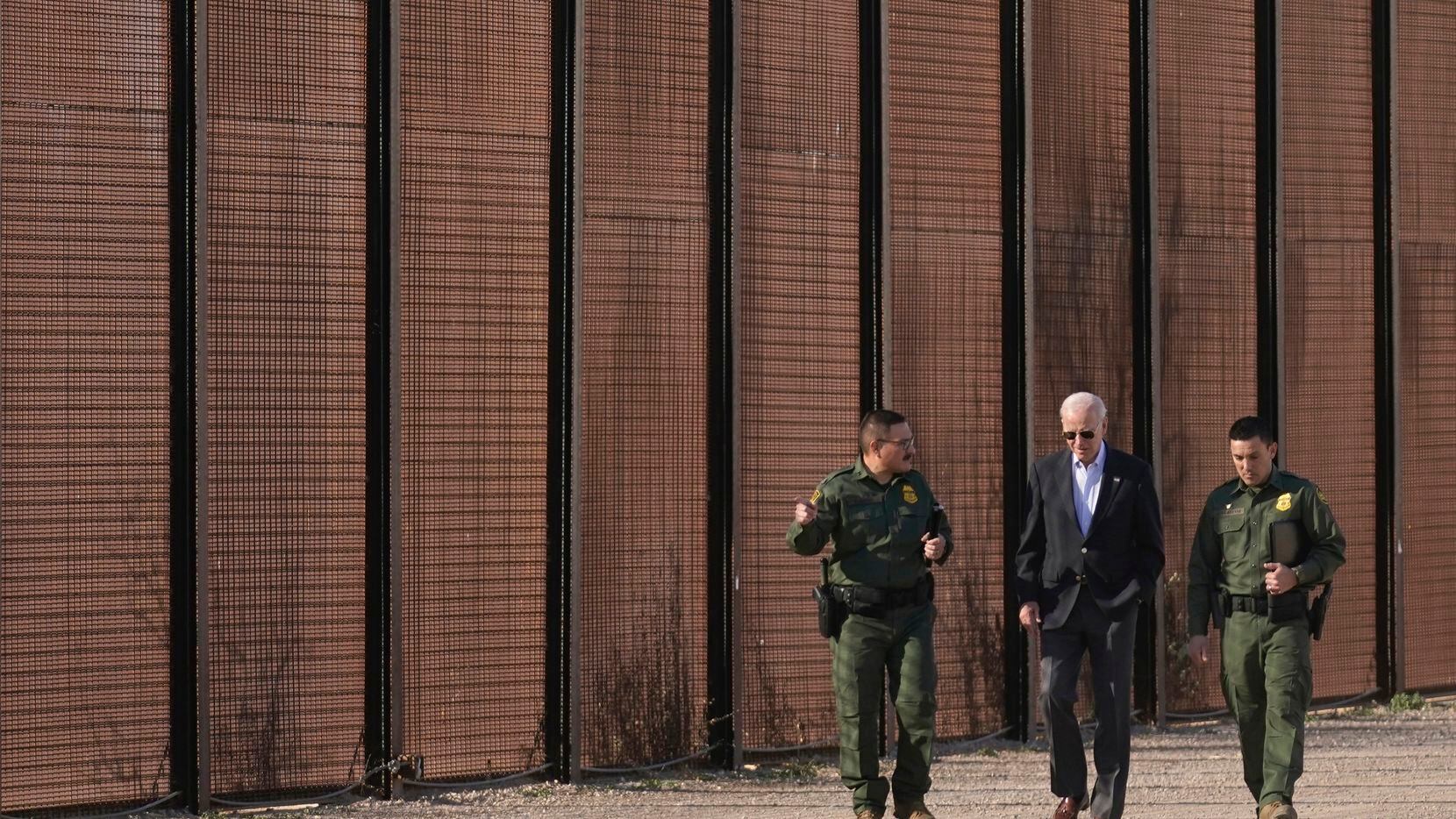 President Joe Biden walked with U.S. Border Patrol agents along a stretch of the U.S.-Mexico...