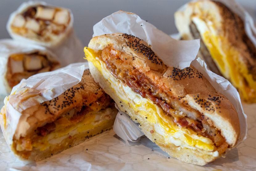 The Shug is a breakfast sandwich made with with bacon, egg, cheese and a hash brown on a...
