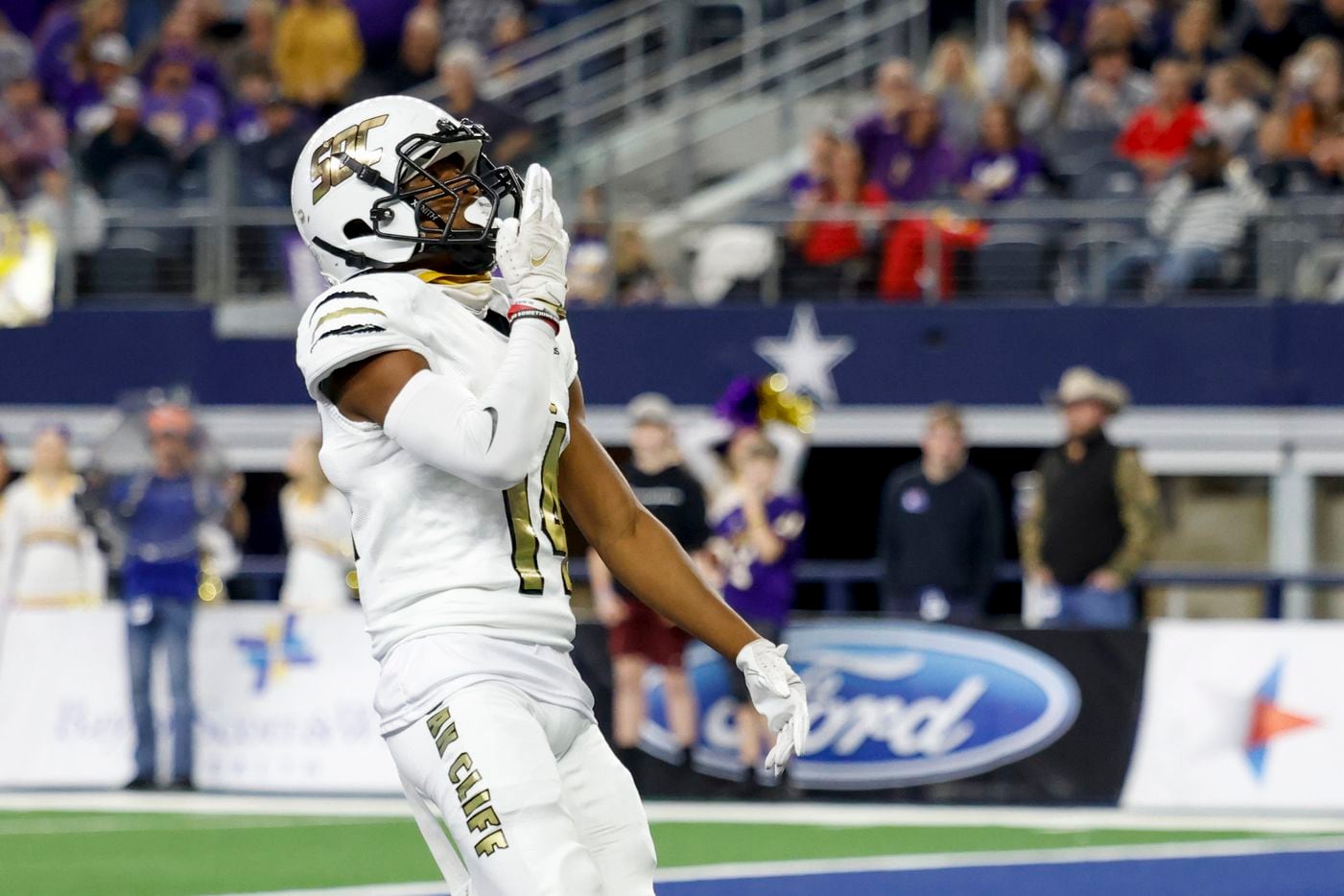 South Oak Cliff wide receiver Corinthean Coleman (14) celebrates after catching a touchdown pass from South Oak Cliff quarterback Kevin Henry-Jennings (8) nduring the first quarter of their Class 5A Division II state championship game at AT&T Stadium in Arlington, Saturday, Dec. 18, 2021. (Elias Valverde II/The Dallas Morning News)