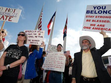 Thousands protest for immigrant and refugee communities in downtown in front of Dallas City...