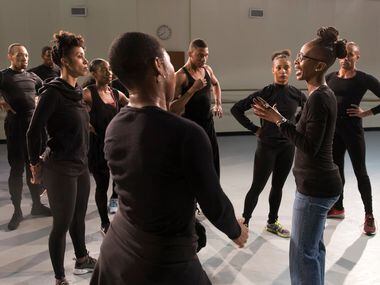 Michelle N. Gibson talks to members of Dallas Black Dance Theatre as they rehearse...