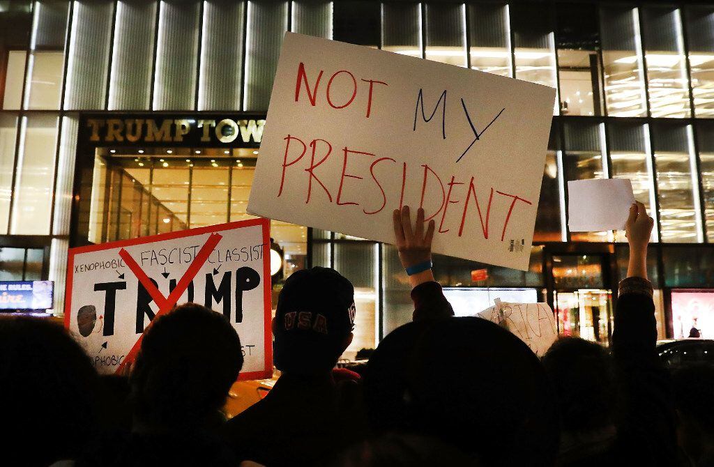Anti-Trump protesters gathered Thursday outside Trump Tower in New York. (Spencer...