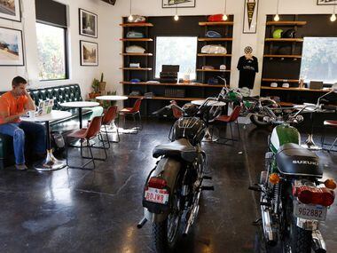 Josh Cogan of Dallas relaxes at Local Moto + Provisions, a vintage motorcycle repair shop...