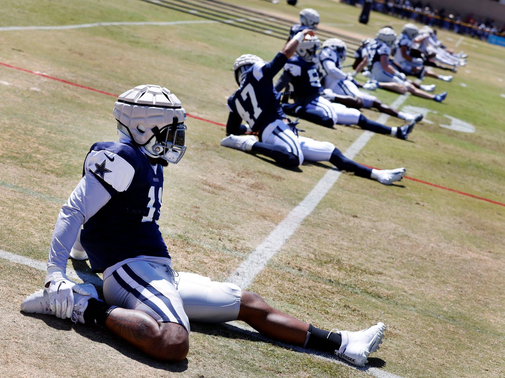 Dallas Cowboys outside linebacker Micah Parsons (11) stretches before training camp practice...