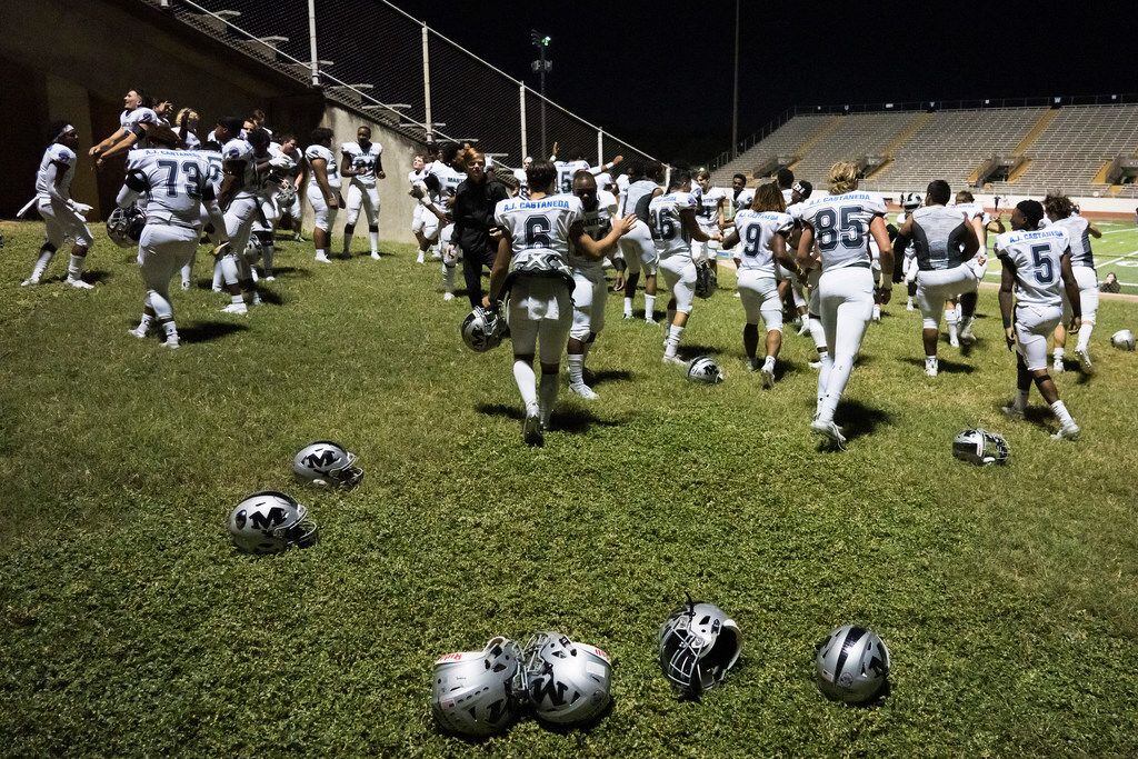Arlington Martin players dance to the song Ã’This is How We Do ItÃ outside the locker room...