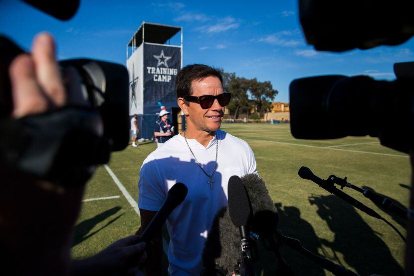 Actor and businessman Mark Wahlberg spoke to reporters during an afternoon practice at the...
