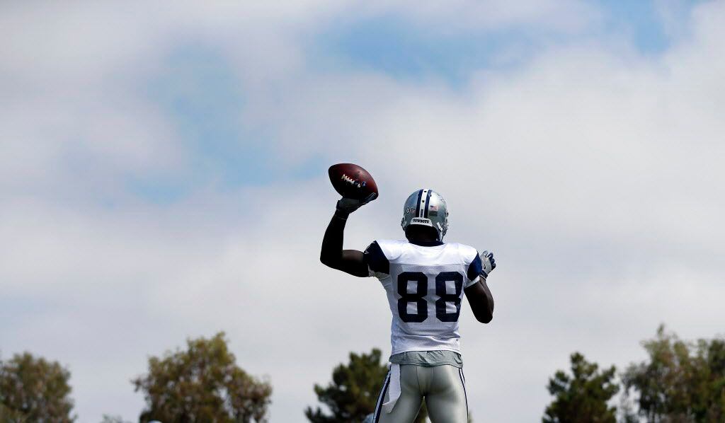 Dallas Cowboys wide receiver Dez Bryant (88) tosses the ball around before the Blue-White...