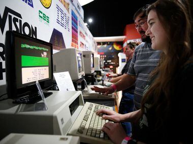 Lauren Howard and Taylor Carter play Oregon Trail at the National Videogame Museum in Frisco...