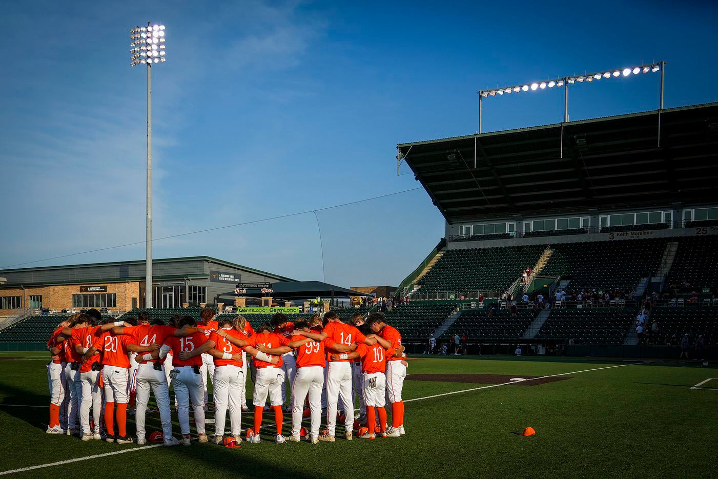 Celina players huddle in the outfield after a loss to Sinton in a UIL 4A baseball state...