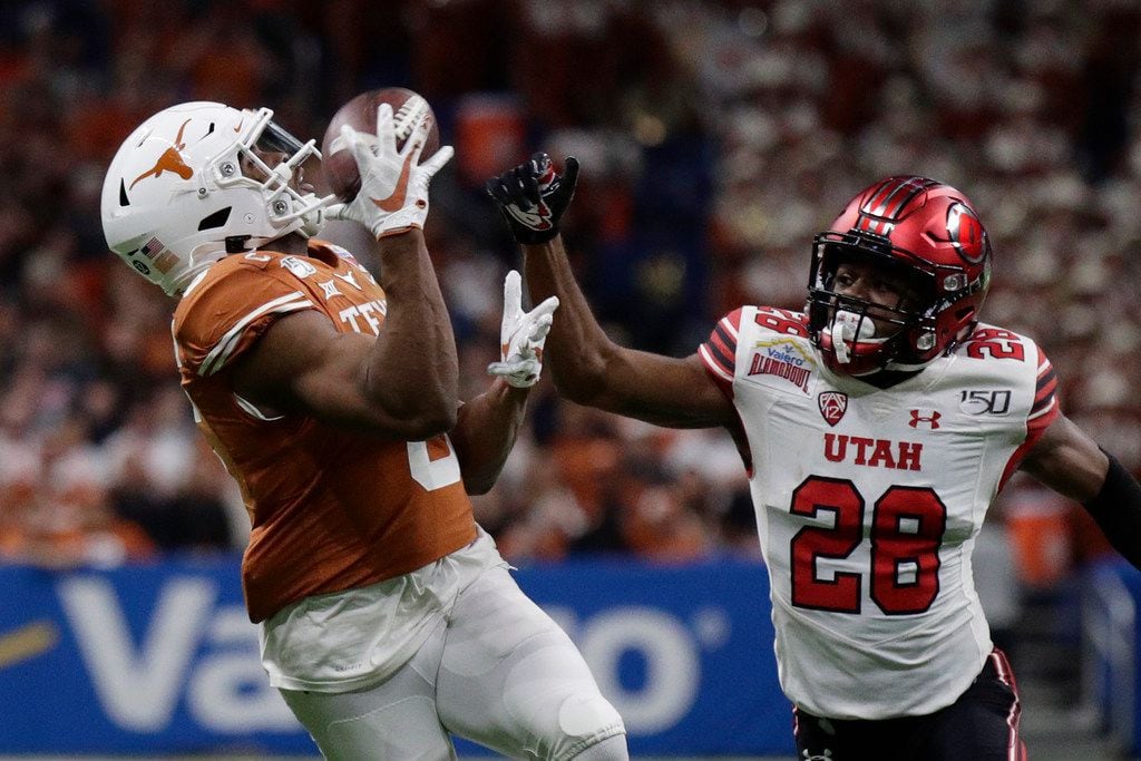 Texas wide receiver Devin Duvernay (6) makes a catch in front of Utah defensive back Javelin Guidry (28) during the first half of the Longhorns’ 38-10 Alamo Bowl victory in San Antonio, Tuesday, Dec. 31, 2019. (AP Photo/Eric Gay)