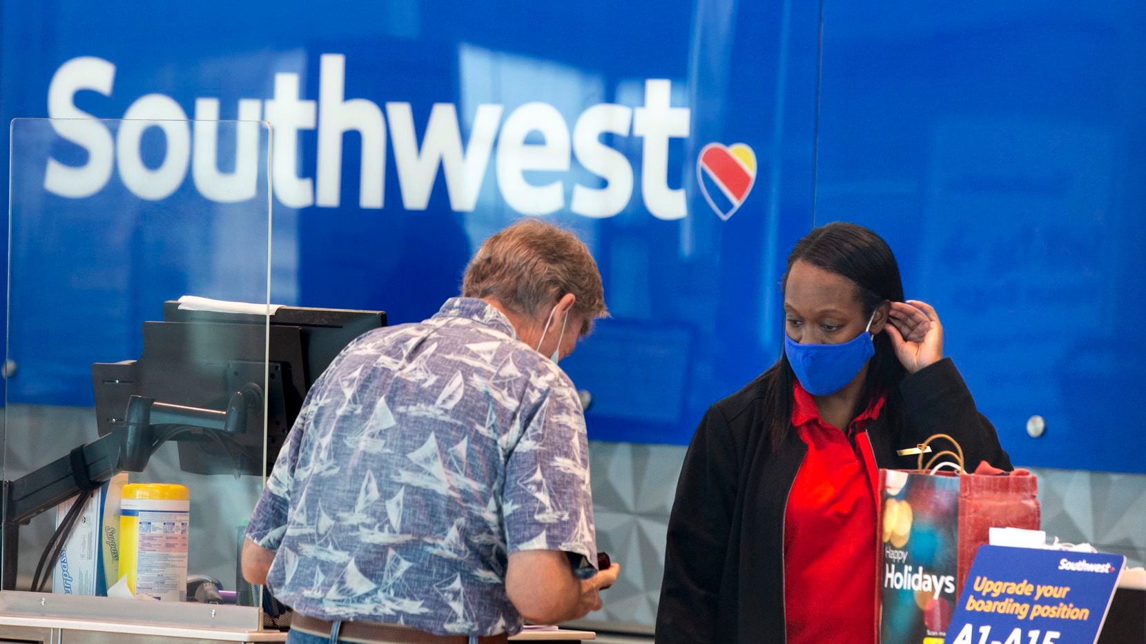 Southwest Airlines employee Ericka Thompson helped a customer at Dallas Love Field in Dallas...