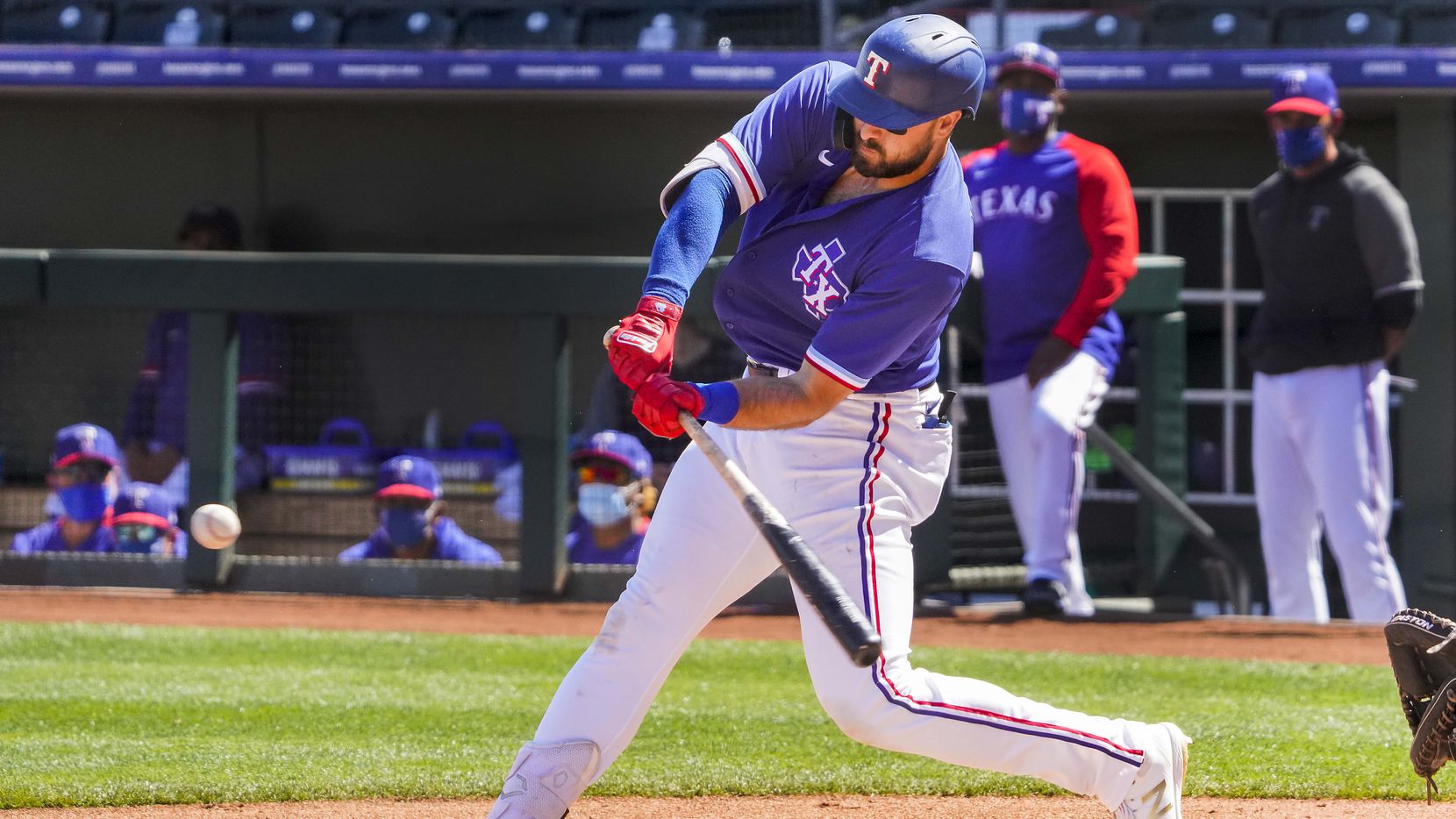 Texas Rangers outfielder Joey Gallo hits a solo home run during the first inning of a spring training game against the Cleveland Indians at Surprise Stadium on Tuesday, March 9, 2021, in Surprise, Ariz.