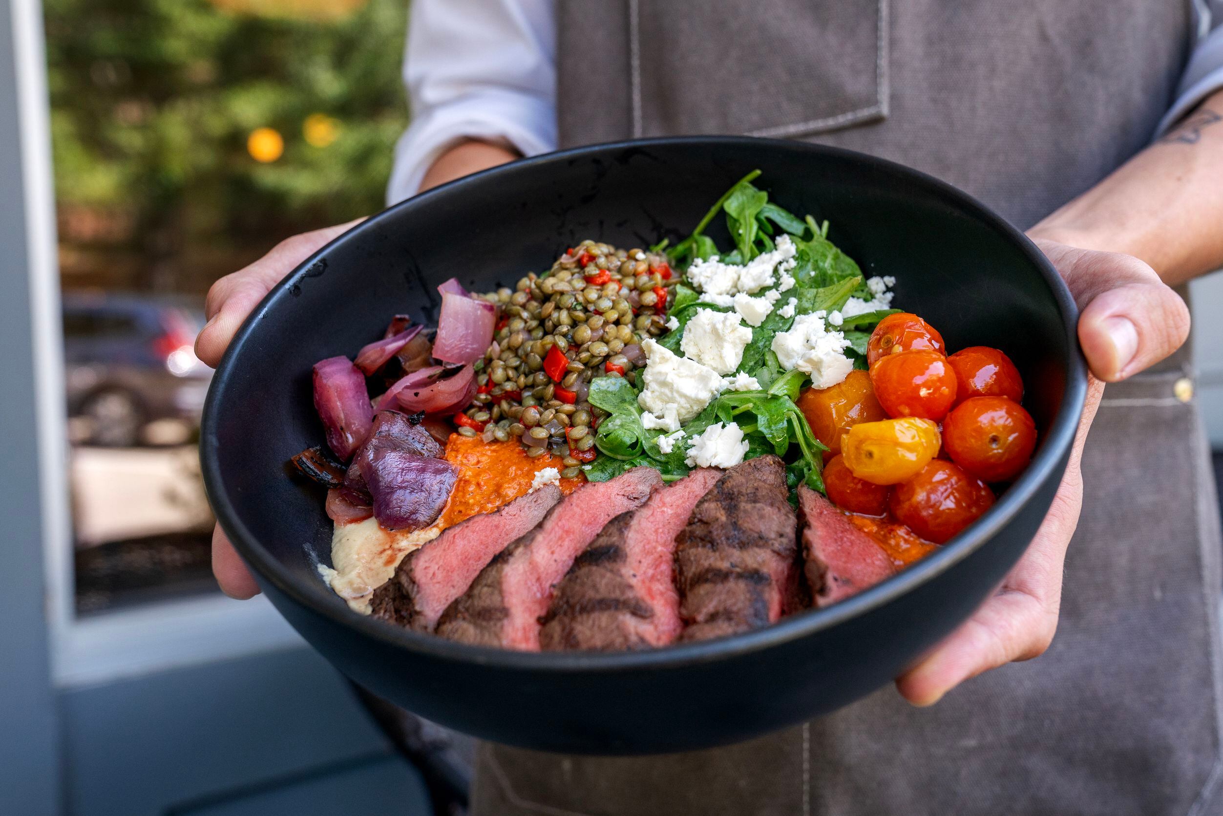 A steak bowl, an item on the lunch menu, is shown at Sachet, a Mediterranean restaurant,...