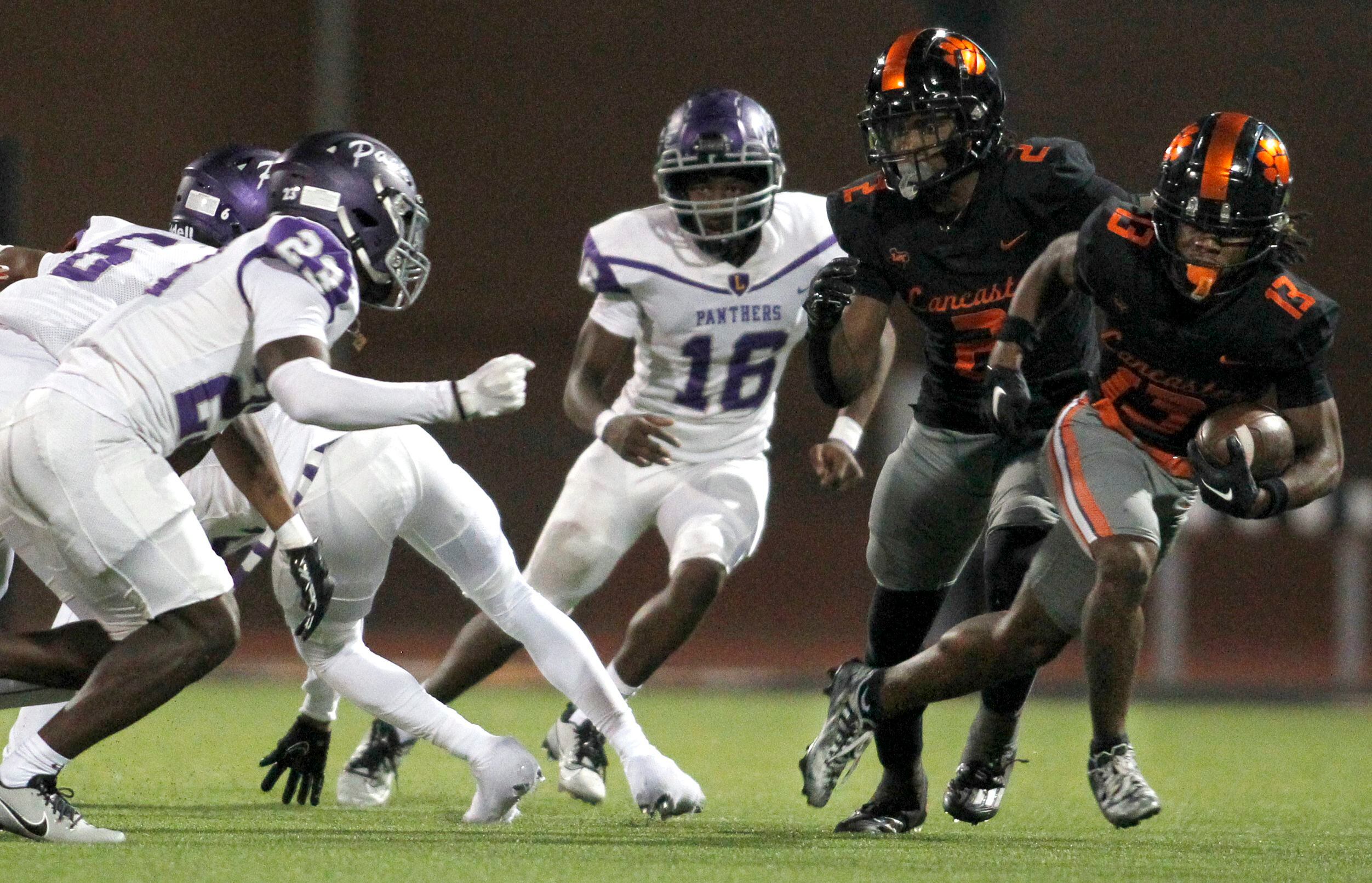 Lancaster receiver Jerbrandin Henderson (13), right, sprints out of the backfield as running...
